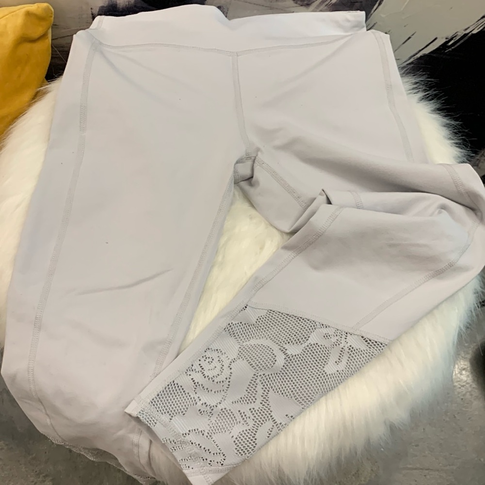 Silvery Fabletics Leggings with floral detail. Looks free people.
